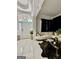 Welcoming entryway with arched door, marble floors, and a view into the stylish living room at 6409 Caledon Ct, Locust Grove, GA 30248