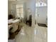 Inviting foyer with marble floors and a white front door with decorative glass at 6409 Caledon Ct, Locust Grove, GA 30248