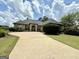 Charming single-story home features a well-maintained front yard, a long driveway, and a welcoming entrance at 6409 Caledon Ct, Locust Grove, GA 30248