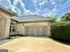 Spacious two-car garage with attractive doors and a wide driveway for easy access at 6409 Caledon Ct, Locust Grove, GA 30248