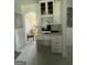 Bright home office with white cabinets, granite counters and stylish honeycomb tile backsplash at 6409 Caledon Ct, Locust Grove, GA 30248