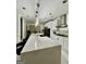 Well-appointed kitchen with a spacious center island, stainless steel appliances, and designer fixtures, perfect for cooking at 6409 Caledon Ct, Locust Grove, GA 30248