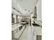Spacious kitchen features a large island, modern appliances and stylish lighting fixtures at 6409 Caledon Ct, Locust Grove, GA 30248