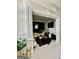 Open living room with marble floors and elegant décor with a view of the stylish seating area at 6409 Caledon Ct, Locust Grove, GA 30248