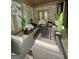 Inviting outdoor patio with comfortable seating, stylish decor and cozy fire pit for relaxing evenings at 6409 Caledon Ct, Locust Grove, GA 30248