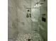 Modern bathroom shower featuring stylish gray tile, built-in niche, and elegant showerhead at 6409 Caledon Ct, Locust Grove, GA 30248