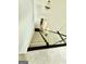 Modern staircase with glass railing and plush carpet, blending style and safety at 6409 Caledon Ct, Locust Grove, GA 30248