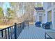 Relaxing back deck area featuring comfortable seating and wooded views at 551 Lees Mill Rd, Fayetteville, GA 30214