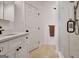 Bathroom featuring a white vanity, a shower with white tile, and modern fixtures at 551 Lees Mill Rd, Fayetteville, GA 30214