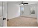 Bright bedroom with new carpet, two windows, and a ceiling fan at 551 Lees Mill Rd, Fayetteville, GA 30214