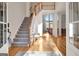 Bright and airy foyer with hardwood floors, staircase, and soaring ceilings at 551 Lees Mill Rd, Fayetteville, GA 30214