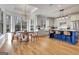 Bright kitchen with white cabinets, stainless steel appliances, hardwood floors, and eat in dining area at 551 Lees Mill Rd, Fayetteville, GA 30214