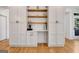 White cabinets with wooden shelving, stainless steel appliances, and a coffee bar area at 551 Lees Mill Rd, Fayetteville, GA 30214