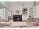 Spacious living room with fireplace, hardwood floors, and a comfortable seating area at 551 Lees Mill Rd, Fayetteville, GA 30214