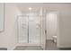 This bathroom has a glass enclosed shower, and a tile floor at 332 Sinclair Ct # 77, Mcdonough, GA 30253