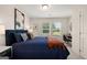 Well-lit bedroom with a desk and chair, large window, and stylish furniture at 332 Sinclair Ct # 77, Mcdonough, GA 30253