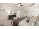 This bedroom boasts an ensuite bathroom, a dresser, and a sitting area beneath the window at 332 Sinclair Ct # 77, Mcdonough, GA 30253