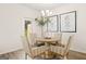 Dining room with a chandelier, round table, and four chairs, offering a cozy space at 332 Sinclair Ct # 77, Mcdonough, GA 30253