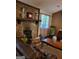 Inviting living room with stone fireplace, wooden mantel, and view of leather sofa at 259 Independence Dr, Jonesboro, GA 30238