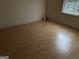 Bright, minimalist bedroom with laminate flooring and natural light at 4355 Hambrick Pl, Stone Mountain, GA 30083