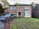 Charming brick home with a well-manicured lawn and attached garage at 4355 Hambrick Pl, Stone Mountain, GA 30083