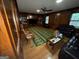 Spacious living room with hardwood floors, wood paneling, and ample natural light at 4355 Hambrick Pl, Stone Mountain, GA 30083