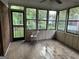 Bright sunroom with multiple windows offering serene backyard views at 4355 Hambrick Pl, Stone Mountain, GA 30083