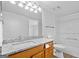 Bathroom features granite countertops, updated fixtures, and shower/tub combo at 843 Seasons Pkwy, Norcross, GA 30093