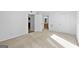 Carpeted bedroom with a view of the kitchen and bathroom with a wood vanity at 843 Seasons Pkwy, Norcross, GA 30093