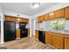 Bright kitchen features updated appliances, granite countertops, and ample cabinet space at 843 Seasons Pkwy, Norcross, GA 30093