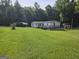 A beautiful single-story home with a lovely deck and covered parking space at 323 Hollonville Rd, Brooks, GA 30205