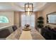 Elegant dining room featuring a marble table, modern chandelier, and a stylish sideboard at 85 Eastwood Frst, Covington, GA 30014
