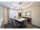 Elegant dining room featuring a marble table, modern chandelier, and a stylish sideboard at 85 Eastwood Frst, Covington, GA 30014