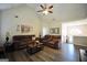 Comfortable living room featuring vaulted ceiling, ceiling fan, hardwood floors and cozy seating at 85 Eastwood Frst, Covington, GA 30014
