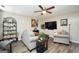 Relaxing living room with hardwood floors, contemporary decor, and lots of seating at 85 Eastwood Frst, Covington, GA 30014