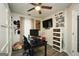 Office featuring a ceiling fan, closet, wood floors, and a desk at 85 Eastwood Frst, Covington, GA 30014