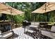 Outdoor patio area with outdoor seating, and a charcoal grill at 85 Eastwood Frst, Covington, GA 30014