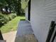 Newly painted brick home exterior with concrete steps and black metal front door at 2934 Harris St, East Point, GA 30344