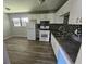 Bright kitchen with white cabinets, modern appliances, and mosaic backsplash at 2934 Harris St, East Point, GA 30344