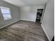 Open living room featuring new flooring and neutral paint, perfect for entertaining at 2934 Harris St, East Point, GA 30344