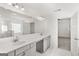 Well-lit bathroom featuring double vanity, quartz countertops, and a glass-enclosed shower at 683 Edgar, Hampton, GA 30228