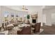 Bright living room with fireplace, large windows, hardwood floors and stylish decor at 683 Edgar, Hampton, GA 30228