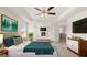 Spacious main bedroom with tray ceiling, ceiling fan, en suite, and an abundance of natural light at 683 Edgar, Hampton, GA 30228