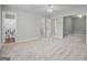 Spacious bedroom with a ceiling fan and view into attached bathroom and walk in closet at 2203 Hyssop Way, Buford, GA 30519
