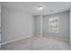 Cozy bedroom with carpet, a neutral color palette, and natural light at 2203 Hyssop Way, Buford, GA 30519