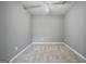 A view of an empty bedroom with a neutral paint color and carpet flooring at 2203 Hyssop Way, Buford, GA 30519