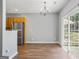 Dining area with hardwood floors and natural light coming from the sliding glass door to the yard at 2203 Hyssop Way, Buford, GA 30519