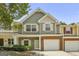 Charming townhome with a one-car garage, landscaped front yard, and a welcoming entrance at 2203 Hyssop Way, Buford, GA 30519