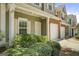 Attractive townhome featuring a one-car garage and a neatly landscaped front entrance at 2203 Hyssop Way, Buford, GA 30519