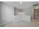 Bright upstairs loft featuring neutral carpet and paint and natural light at 2203 Hyssop Way, Buford, GA 30519